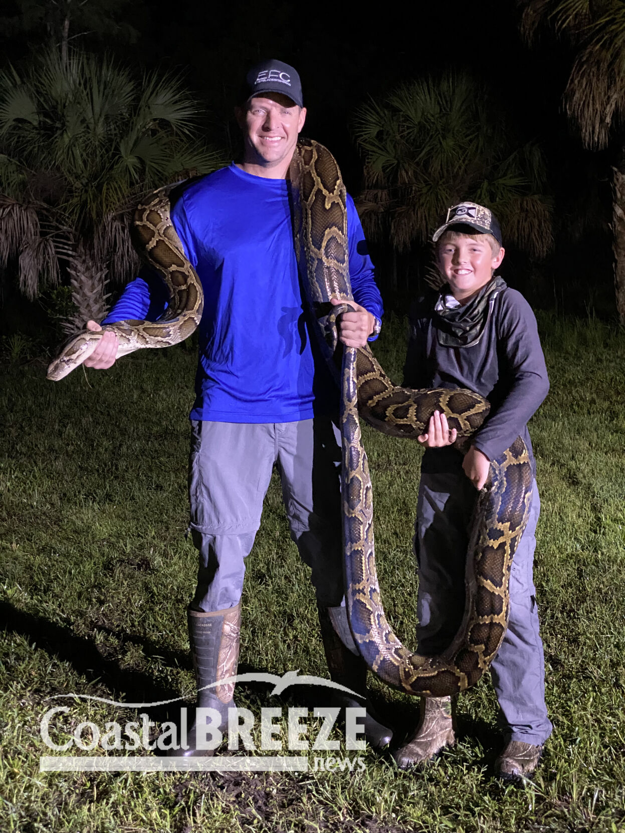 9. Kevin and Luke Carlisle with 16-foot python..JPG